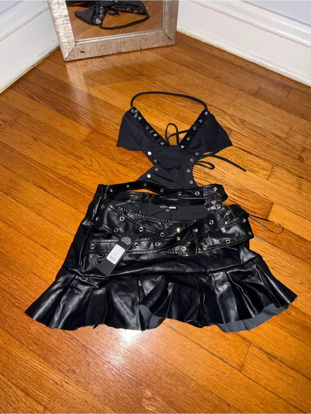 Fashion Nova Black Faux Leather Pleated Mini Skirt one piece with Grommet Detail